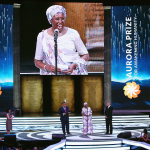Marguerite Barankitse accepts the inaugural Aurora Prize for Awakening Humanity from George Clooney