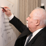 Vartan Gregorian signing pledge wall