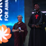 Aurora Prize finalist Father Bernard Kinvi and Hina Jilani