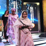 Marguerite Barankitse and Syeda Ghulam Fatima depart stage